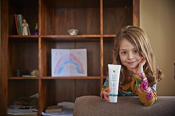 Laura holding Forever Aloe Vera Gelly - Forever Living Products